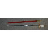 A Masonic sword in red scabbard, apron in case, sash etc Condition Report: Available upon request