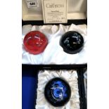 A Caithness Dawn and Dusk boxed paperweights, no 571/750, with certificate and another weight titled