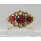 An 18ct gold ruby and diamond cluster ring Birmingham circa 1900, size H, weight 2gms Condition