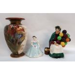 A Doulton Burslem vase and two Royal Doulton figures including The Old Balloon Seller and Bridesmaid