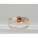 A 9ct orange sapphire and diamond ring, size N1/2, weight 1.6gms. With a GemsTV certificate