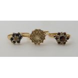 A 9ct sapphire and diamond accent cluster ring size N1/2, a 9ct garnet and clear gem ring size N,