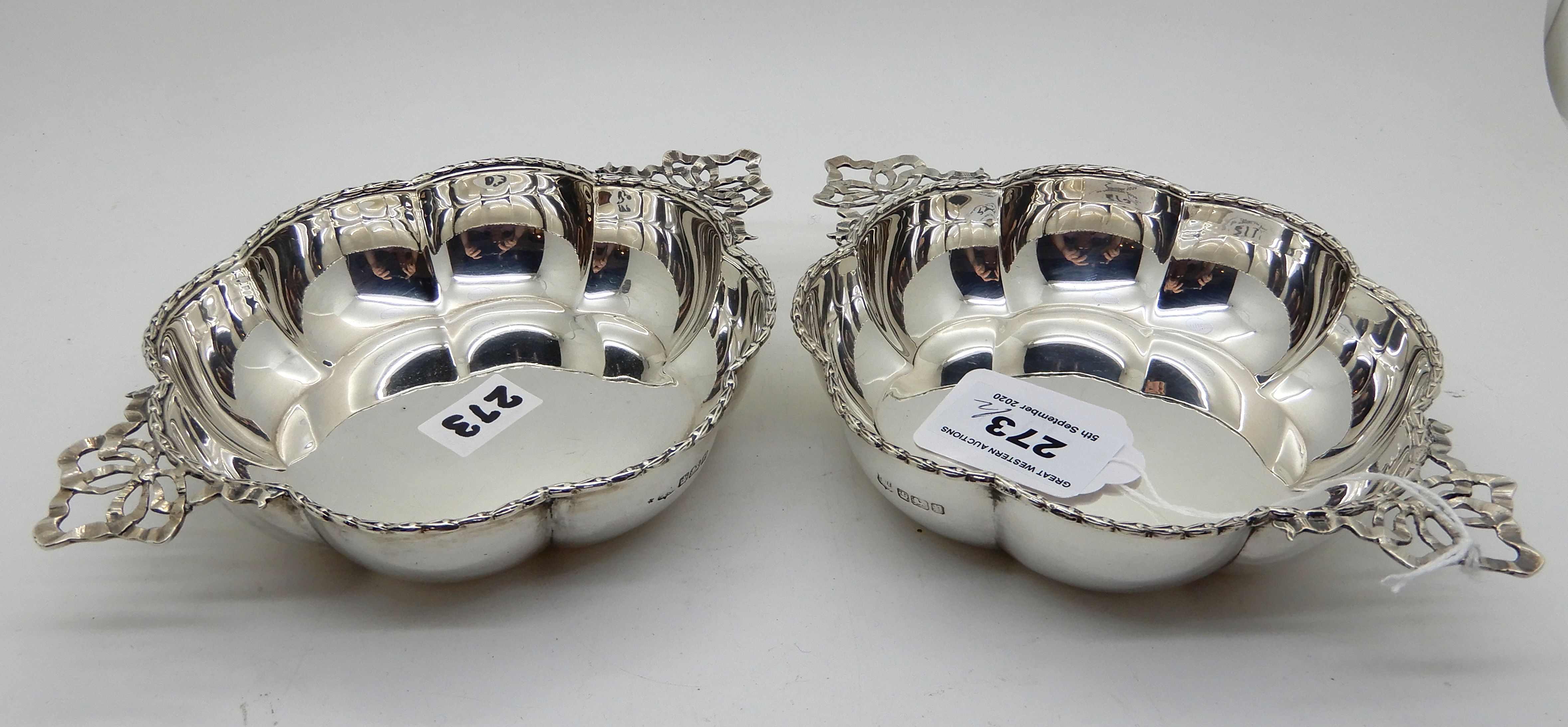 A pair of silver dishes, Sheffield 1907, the lobed body with gadrooned rim with a pair of ribbon