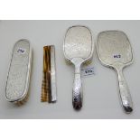 A four piece continental silver dressing table set marked with a crown and 835 Condition Report: