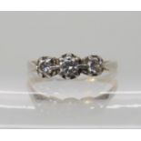 An 18ct gold and platinum three stone diamond ring of estimated approx 0.25cts, finger size Q1/2,