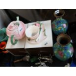 A porcelain rose shaped teapot with matching cup and saucer, a pair of cloisonne vases etc Condition