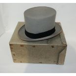 A grey top hat by Austin Reed, 21 x 15cm, in cardboard case Condition Report: Available upon