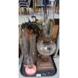 A cut glass oil lamp, a copper example and funnels Condition Report: No condition report available