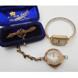 A 9ct gem set brooch, a 9ct gold ladies vintage watch, weight 18.5gms including mechanism, and a