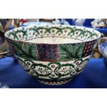 A large lady artist pottery bowl, decorated in the William Morris style, 22cm highx 40cm diameter