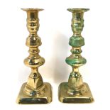 A pair of brass candlesticks Condition Report: Available upon request