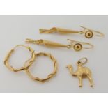 An 18ct gold camel pendant, tassel earrings and a pair of hoop earrings weight combined 7.4gms
