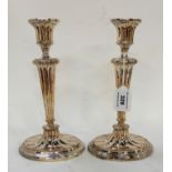 A pair of silver plated candlesticks, 25cm high Condition Report: Available upon request
