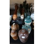 A collection of stoneware bottles and glass bottles Condition Report: No condition report