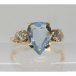 An 18ct gold pearshaped aquamarine and diamond ring, aqua approx 9.8mm x 7.1mm x 3.5mm, diamonds