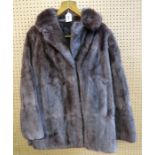 A short brown fur jacket and another jacket Condition Report: No condition report available for this