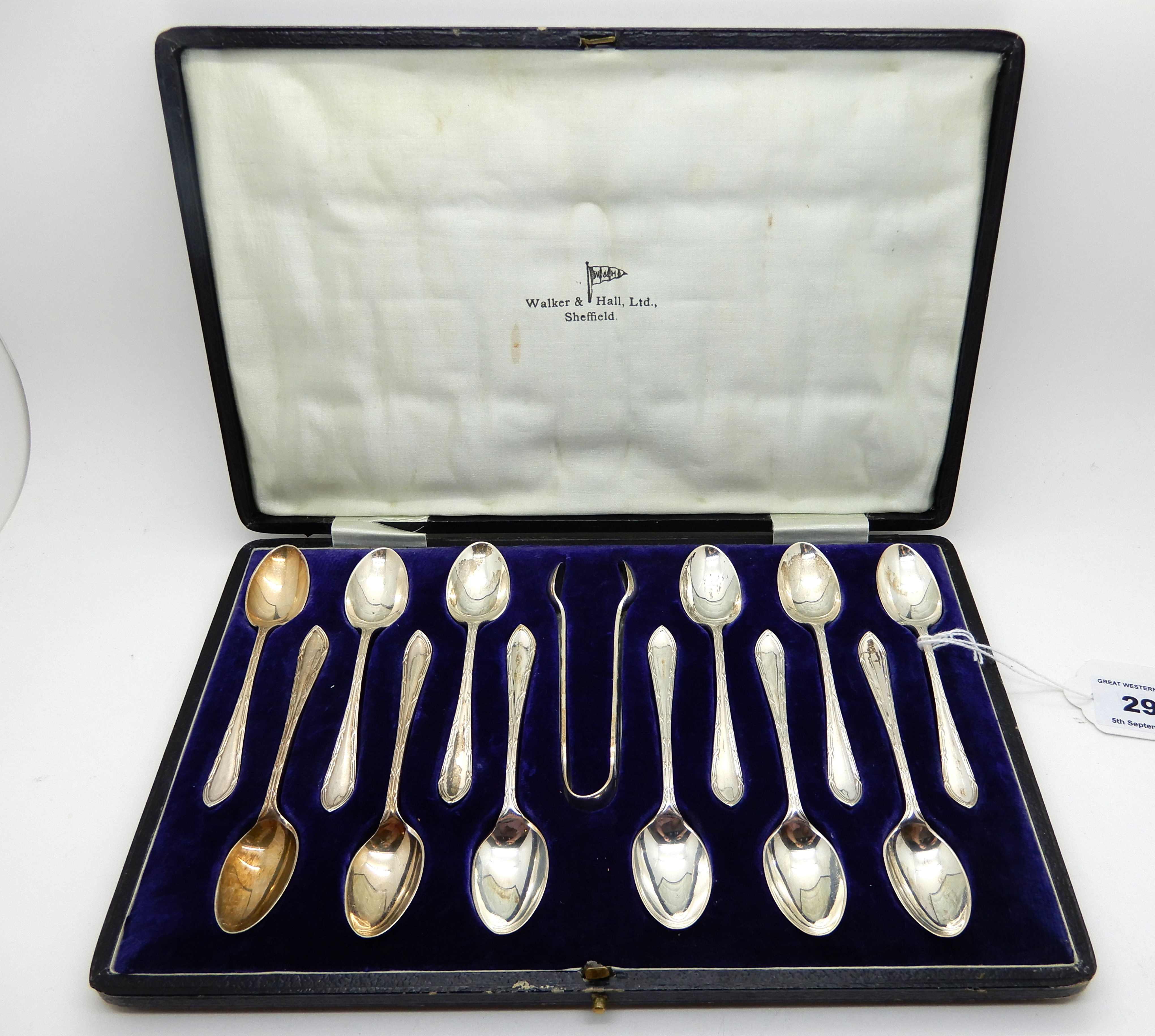 A cased set of twelve silver coffee spoons with tongs, Sheffield 1926 Condition Report: Available