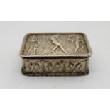 A white metal snuff box, rectangular embossed with classical figures, 6.8cm x 4.8cm