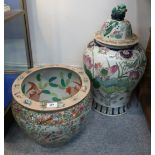 A large Chinese fish bowl decorated with fish inside and birds and foliage to the outside 30cm high,