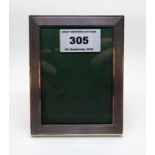 A rectangular silver mounted photo frame by Sanders and Mackenzie, Birmingham 1976, with engine