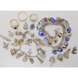 An extensive silver place name charm bracelet, a silver charm bracelet with one 9ct gold charm of