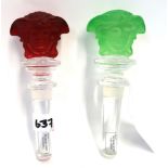 Two Versace Rosenthal crystal Medusa head bottle stoppers, one in green, the other red Condition