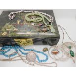 An Oriental lacquer box a silver and malachite necklace, a silver 1780 Maria Theresia coin in