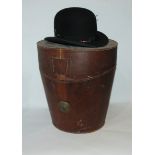 A Victorian leather hat case and a black bowler hat Condition Report: Available upon request