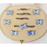 A boxed set of six blue enamelled butterfly buttons with matching brooch Condition Report: No