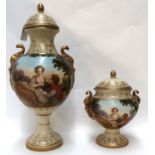 A porcelain urn and cover decorated with a courting couple, 41cm high and a similar smaller
