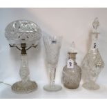 A cut crystal table lamp, two decanters and a large fluted glass Condition Report: Available upon