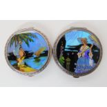 A pair of silver and butterfly wing compacts with reverse painted scenes of ladies in landscapes,