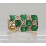 A 14k gold emerald and diamond retro cluster ring (one emerald missing) Head size 16mm x 9.5mm,