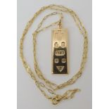 A 9ct gold ingot pendant, length 4.4cm, length of the yellow metal chain 55cm, weight combined 10.
