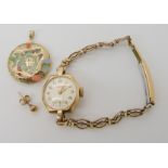 A 9ct gold ladies Benson watch head and a single 9ct earring, weight including strap and mechanism