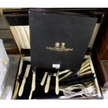 A lot comprising a cased part cutlery set and a cased set of cake cutlery Condition Report: