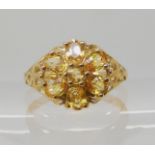 A 9ct gold yellow sapphire flower ring, size N1/2, weight 3gms. With a GemsTV certificate