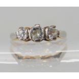 A bright yellow metal three stone diamond ring of estimated approx 0.50cts, size P1/2, weight 2.3gms