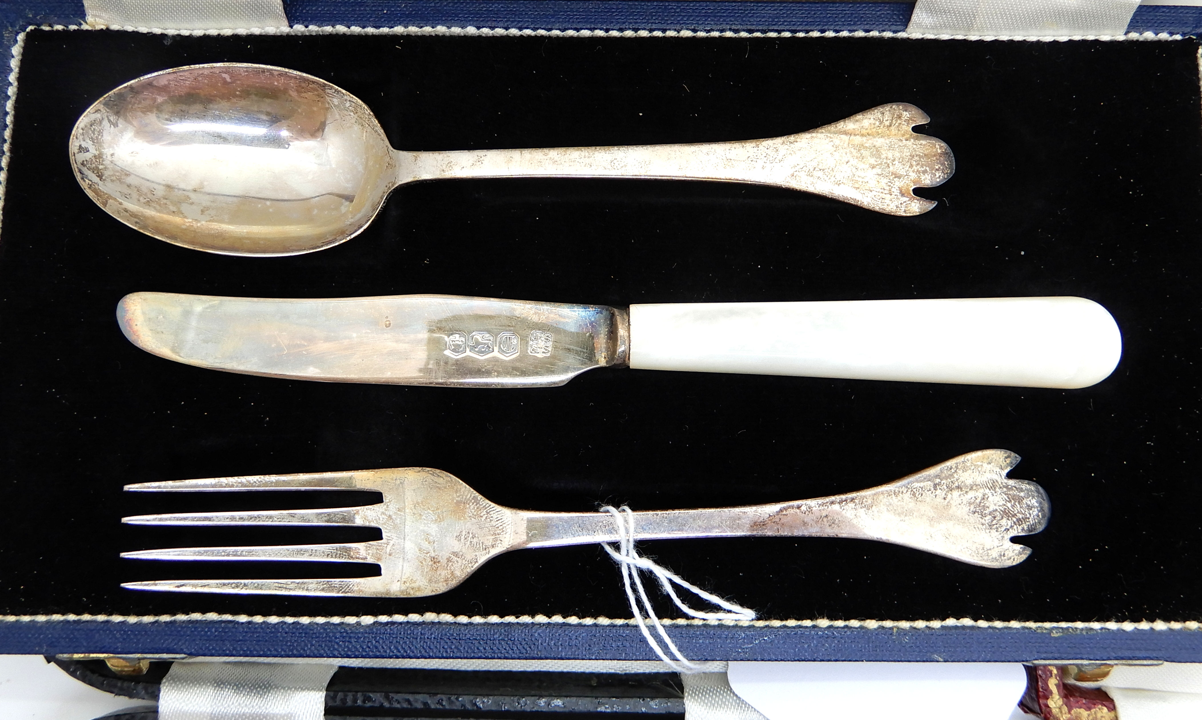 A lot comprising two cased sets of six silver coffee spoons, a cased three piece silver - Image 2 of 2