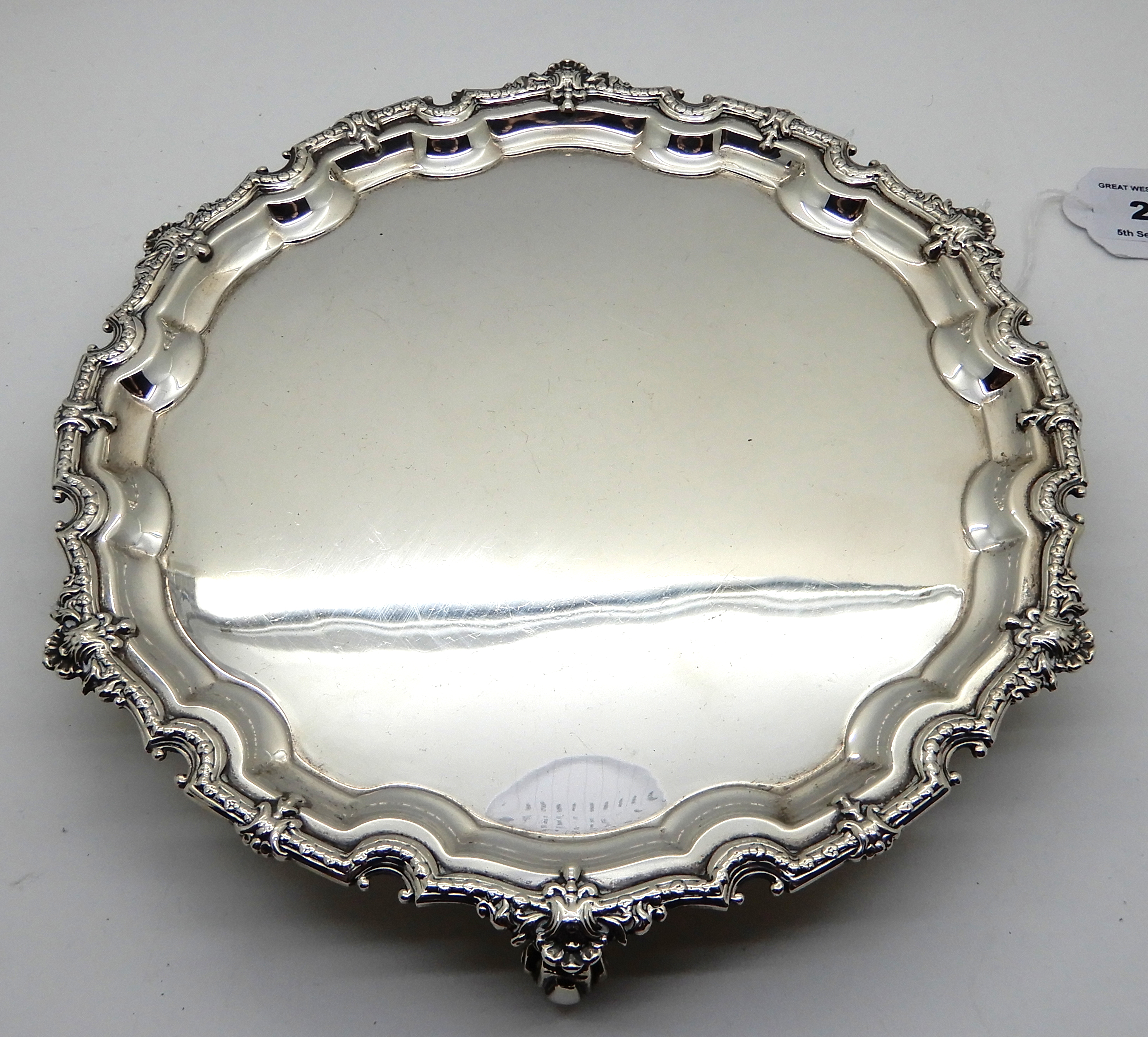 A silver card tray, Birmingham 1973, of circular form, the scalloped rim with shell motif on three - Image 2 of 3