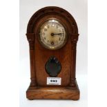 A wooden mantle clock Condition Report: Available upon request