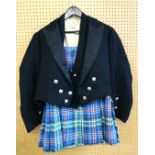 A gents kilt and jacket, other kilts, a ladies green coat,(moth damage) a mustard coat Condition