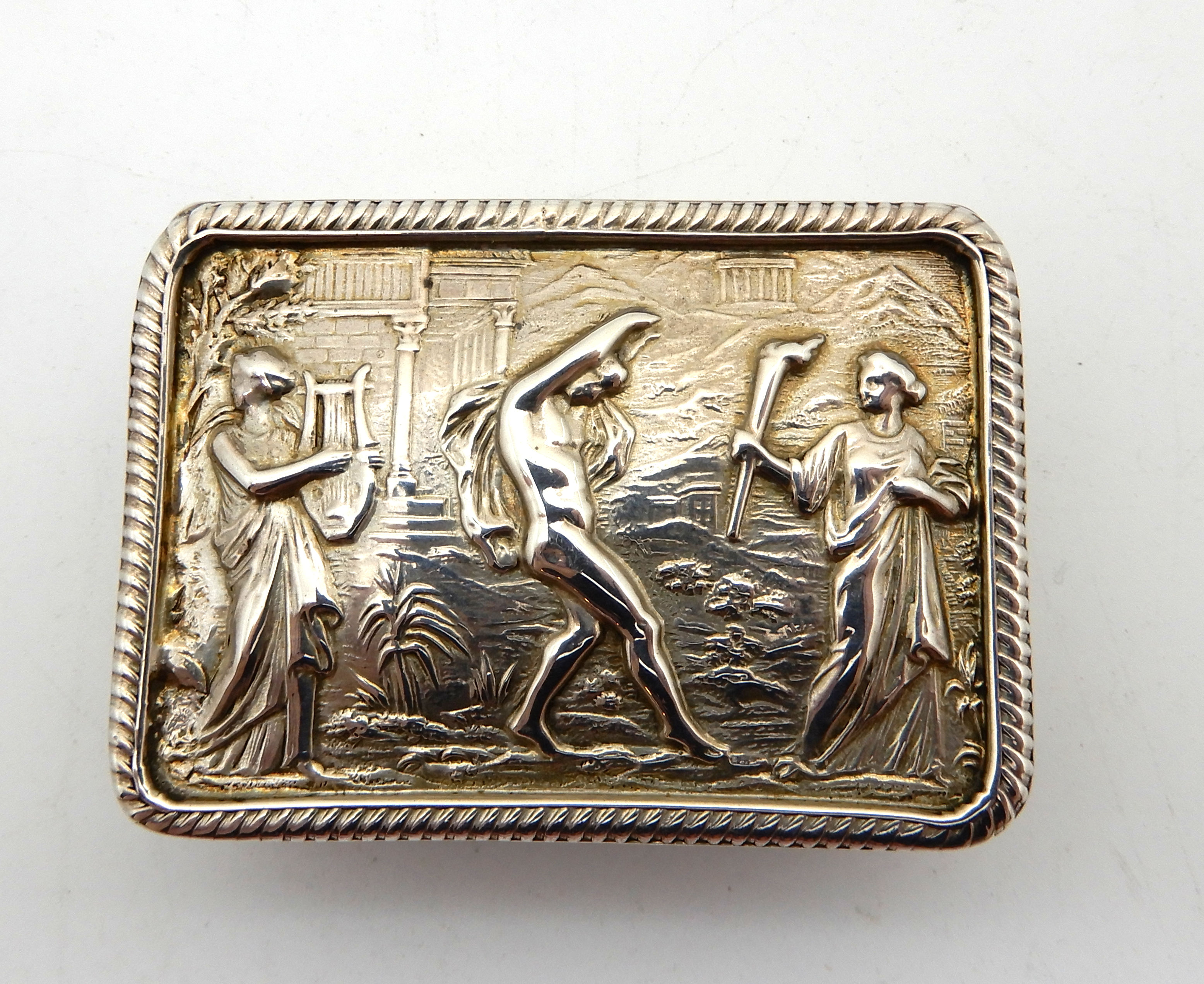 A white metal snuff box, rectangular embossed with classical figures, 6.8cm x 4.8cm - Image 2 of 5