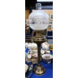 A brass oil lamp with etched shade, 71cm to top of funnel Condition Report: Available upon request