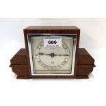 A wooden Elliot clock retailed by Prestons Ltd, 13cm high Condition Report: