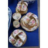 A Hammersley bone china teaset decorated with flowers comprising twelve cups, saucers, plates,