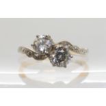 AN 18CT GOLD AND PLATINUM TWIN STONE DIAMOND RING set with estimated approx 0.80cts of brilliant cut