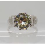 A PLATINUM SUBSTANTIAL DIAMOND RING with AGI certificate which states;- the central diamond is