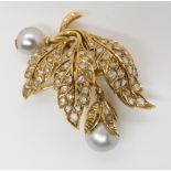 A BRIGHT YELLOW METAL PEARL AND DIAMOND BROOCH with continental hallmarks, set throughout with