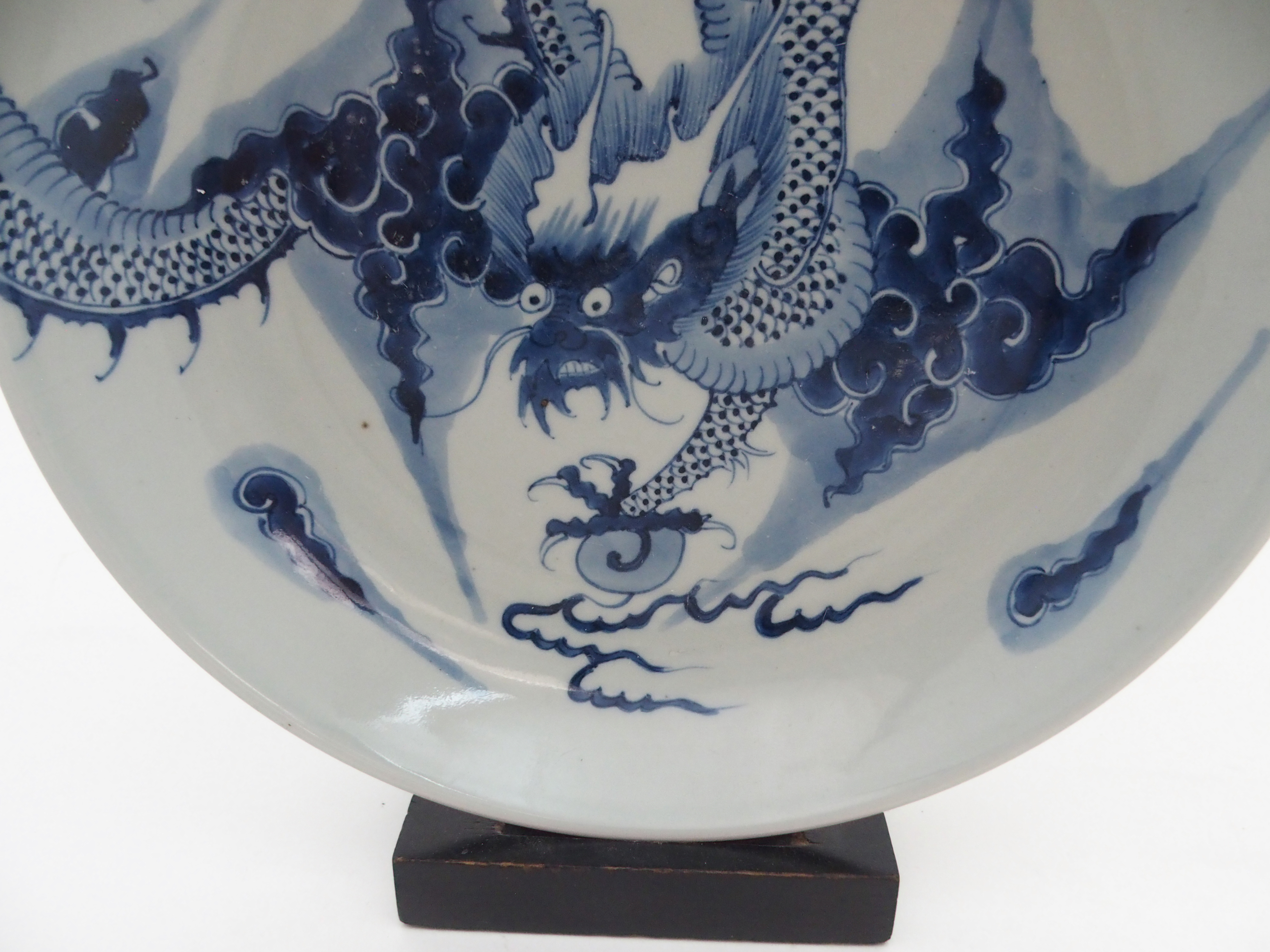 A CHINESE BLUE AND WHITE DISH painted with a dragon chasing the pearl of wisdom, 28cm diameter and - Image 7 of 9